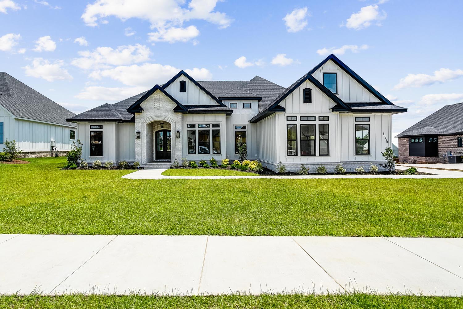 A white luxury home from the street view